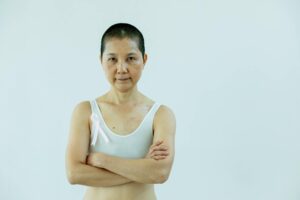 asian woman with arms folded and breast cancer